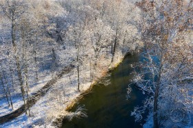 Snow blanketed woods and Clinton River WI10207