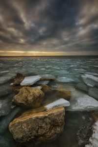 shoreline rocks melting ice photo